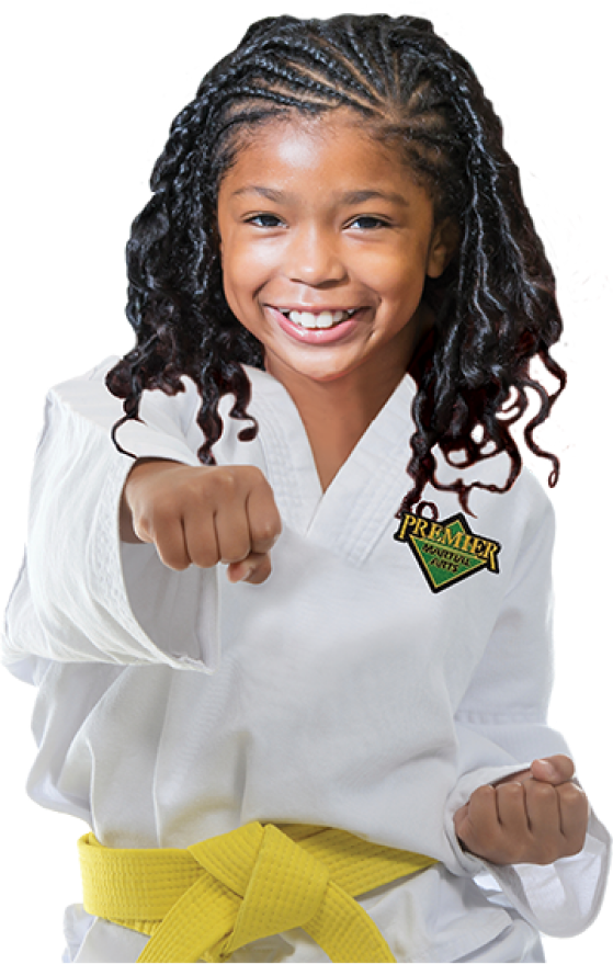 girl in premier martial arts uniform with yellow belt