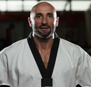 portrait physically fit mature man kimono with black belt (2)