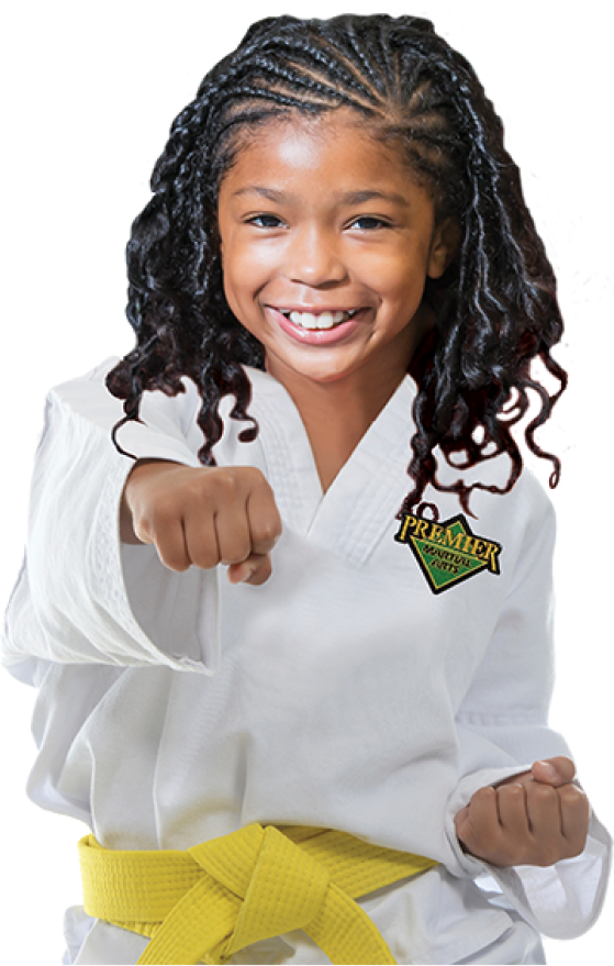 girl in premier martial arts uniform with yellow belt
