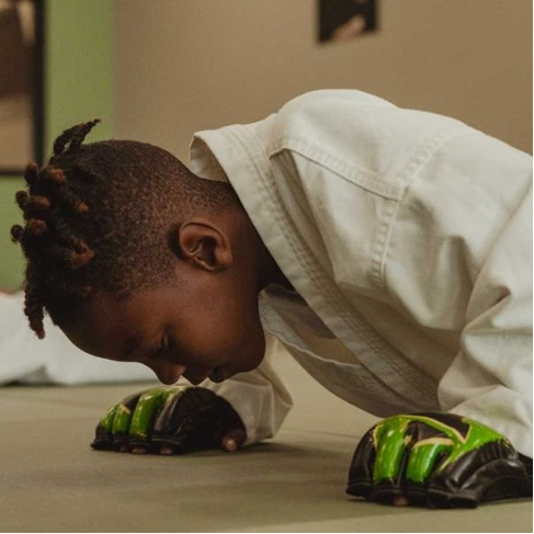 A child focusing in a martial arts practice