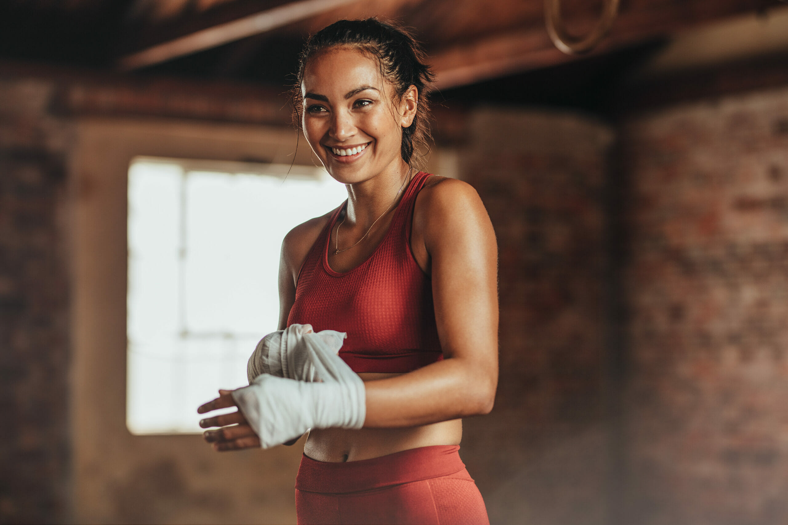 Woman getting ready for boxing practice