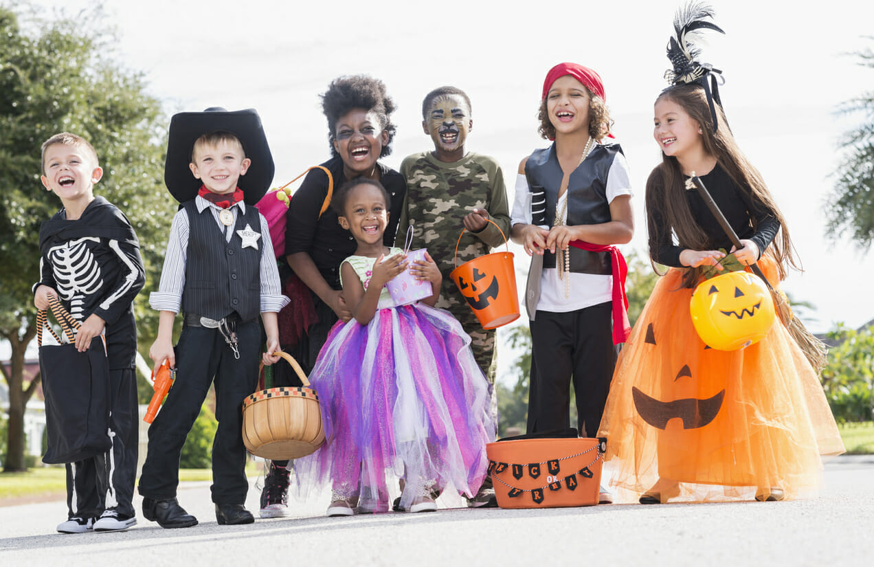 Multi ethnic group of children in halloween costumes