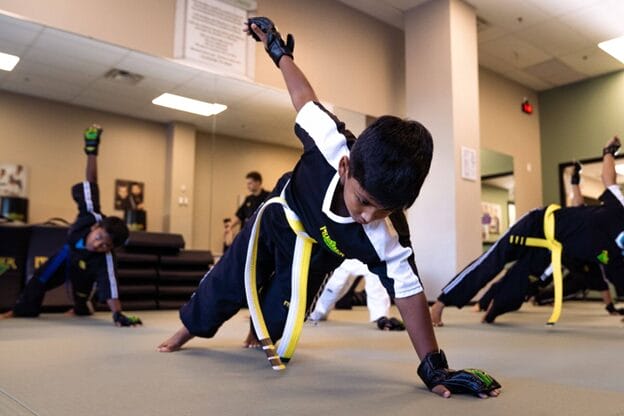 boy balancing during martial arts practice defend-yourself